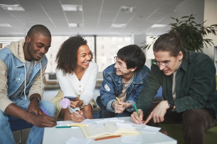University students working on a project together